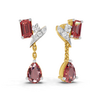 A pair of gold and white gold drop earrings with rectangular red gemstones, small clear accent stones, and teardrop-shaped pink gemstones, shown on a white background.