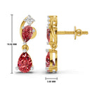 Gold drop earrings with red teardrop-cut gemstones and a small clear stone at the top, shown from front and side views with measurement labels on a white background.