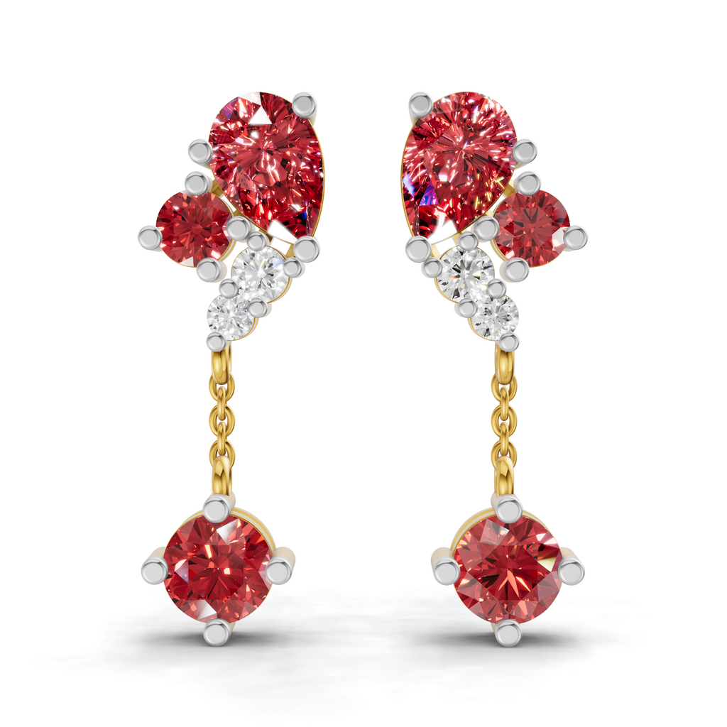 A pair of gold and white gold drop earrings featuring oval-cut red diamonds, round-cut red diamonds, and small clear accent diamonds, shown on a white background.