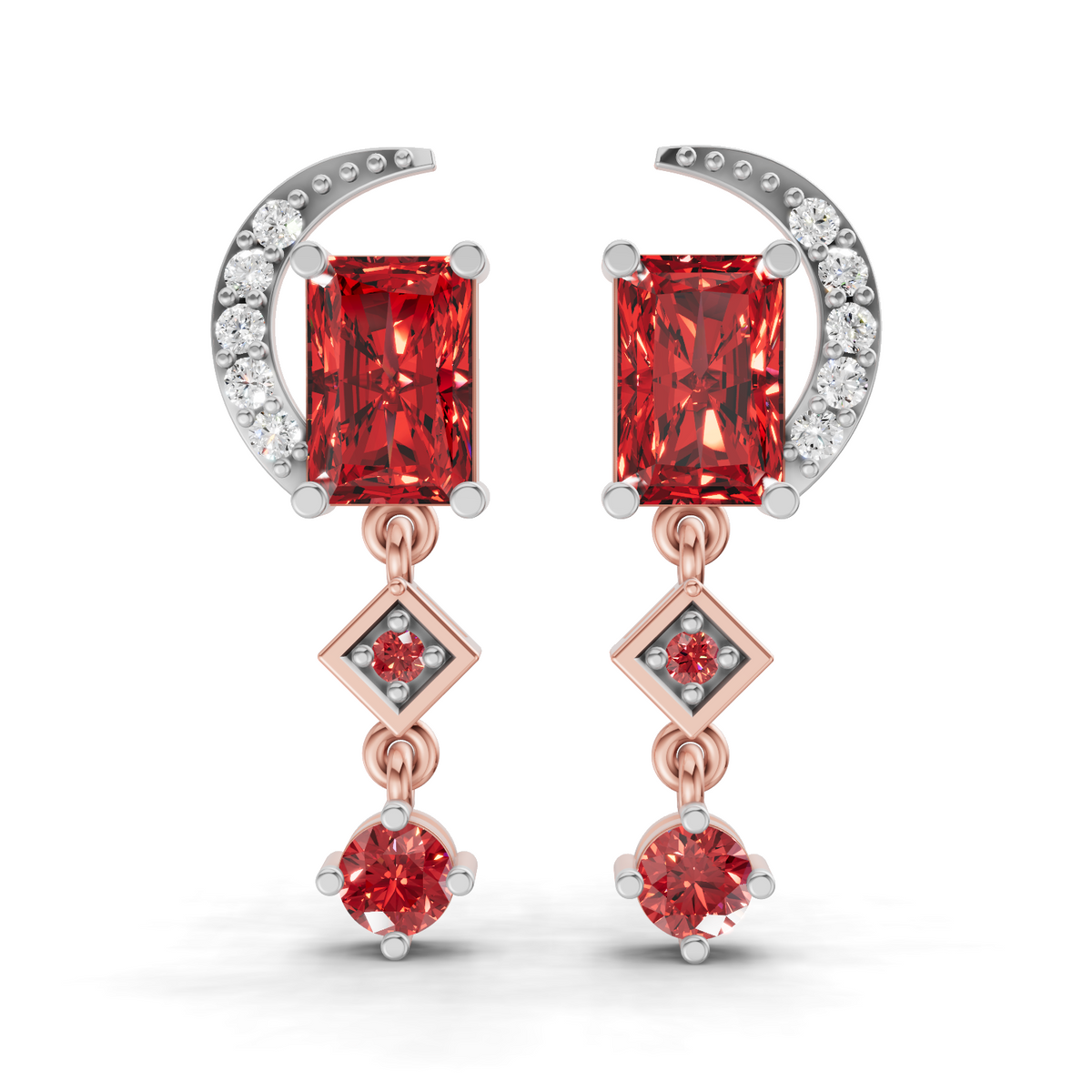 A pair of rose gold and white gold drop earrings featuring rectangular red gemstones, a crescent moon with small clear stones, and diamond-shaped accents on a white background.