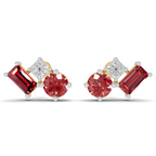 A pair of stud earrings featuring round and baguette-cut red gemstones with a small square-cut clear stone in a silver-toned setting, shown on a plain white background.