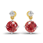 A pair of gold and white gold drop earrings featuring a large round red gemstone and a smaller clear round gemstone at the top, set against a plain white background.