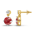 A pair of gold and white gold drop earrings featuring a large round red gemstone and a smaller clear round gemstone, shown from both front and side angles on a white background.