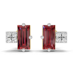 A pair of stud earrings featuring rectangular emerald-cut red gemstones in silver-toned settings, flanked by square clusters of clear stones, shown on a white background.